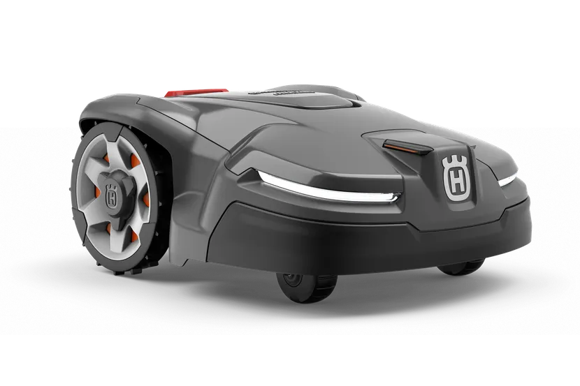 洗練されたデザインと目に見える車輪を備えたハスクバーナのロボット芝刈り機の側面図。